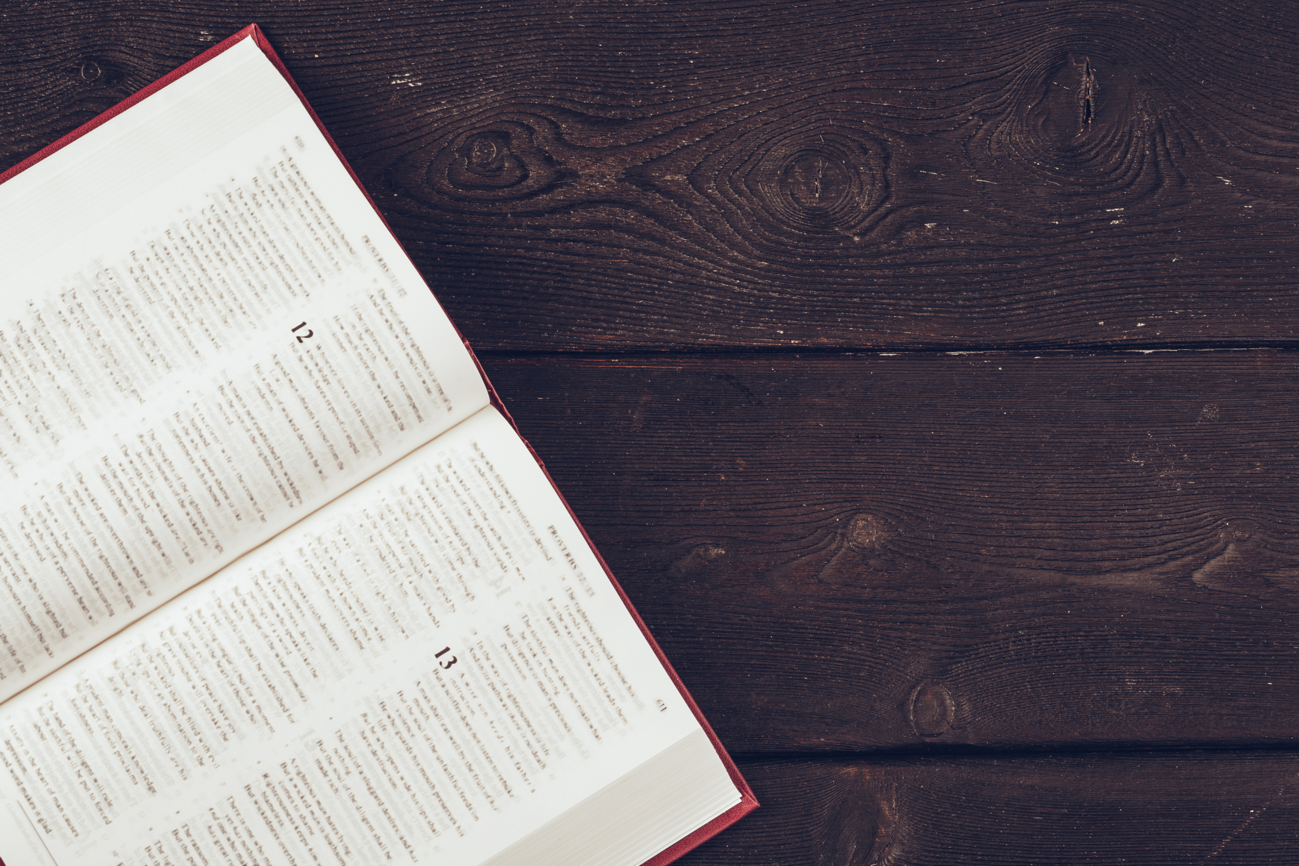 The Holy Bible on a wooden table.